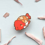 Ranchu Goldfish pin on a light gray background with dried sage leaves
