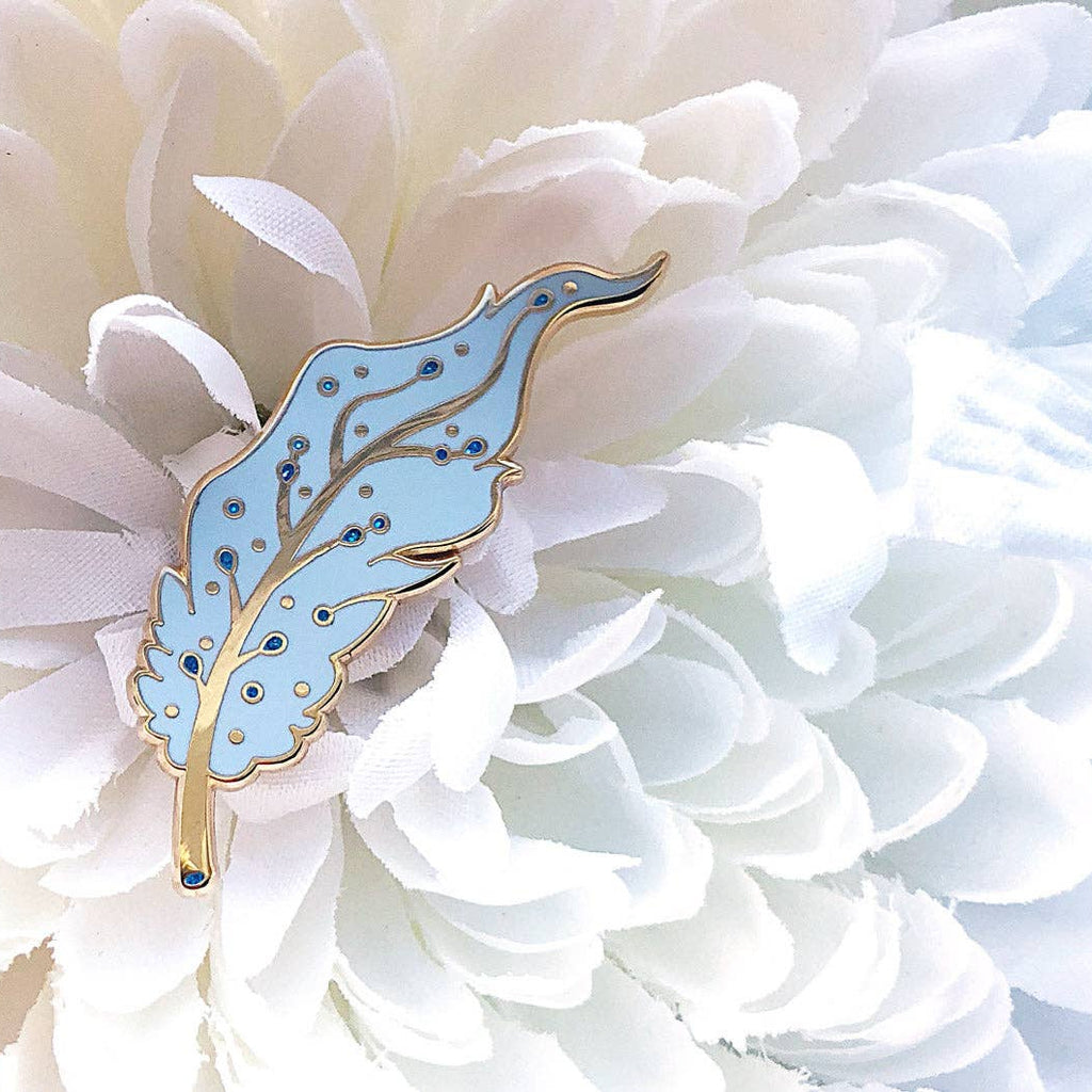 Blue Pegasus decorative item on a white flower