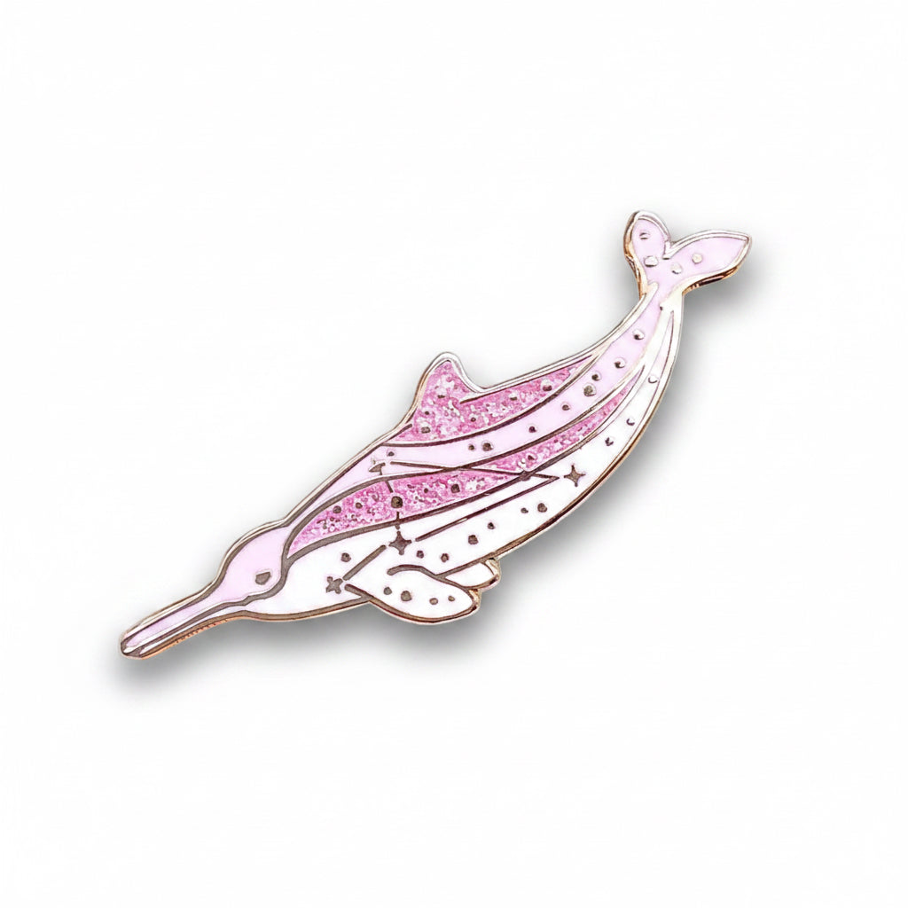 Pink dolphin-shaped pin on a light blue background with yellow flowers