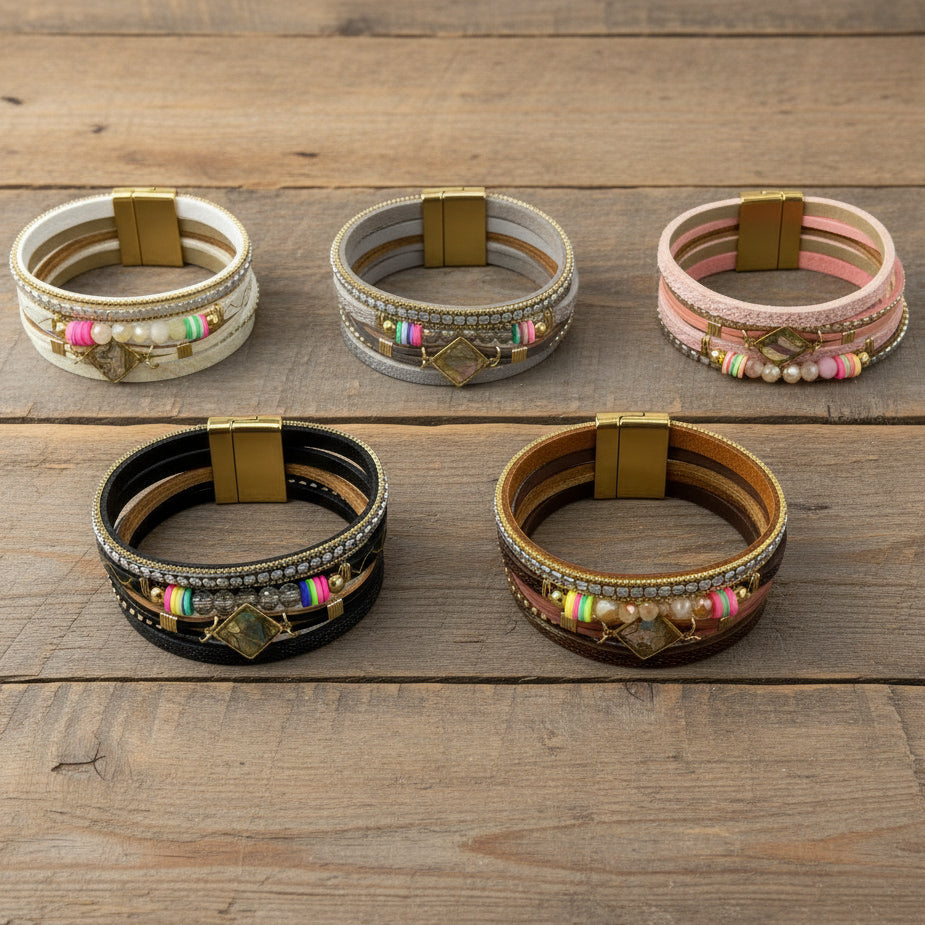 Set of colorful Boho layered bracelets with magnetic closure on a wooden surface