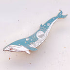 Decorative whale-shaped object on a light background