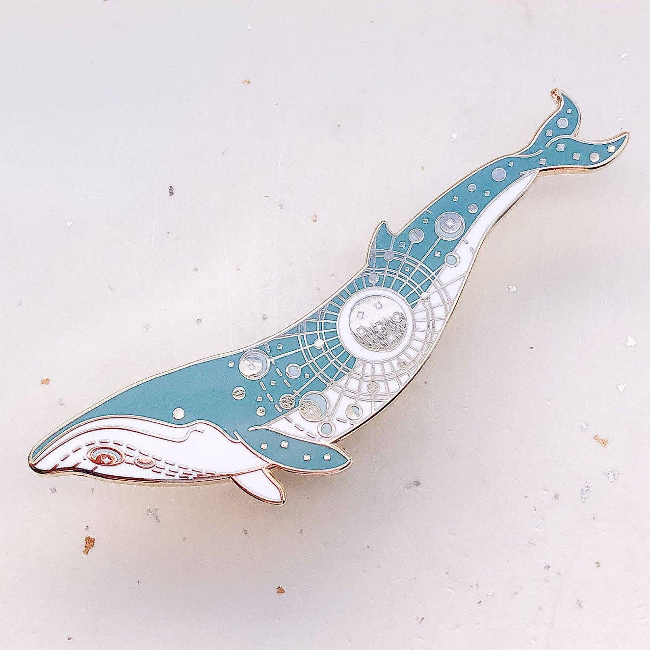 Decorative whale-shaped object on a light background
