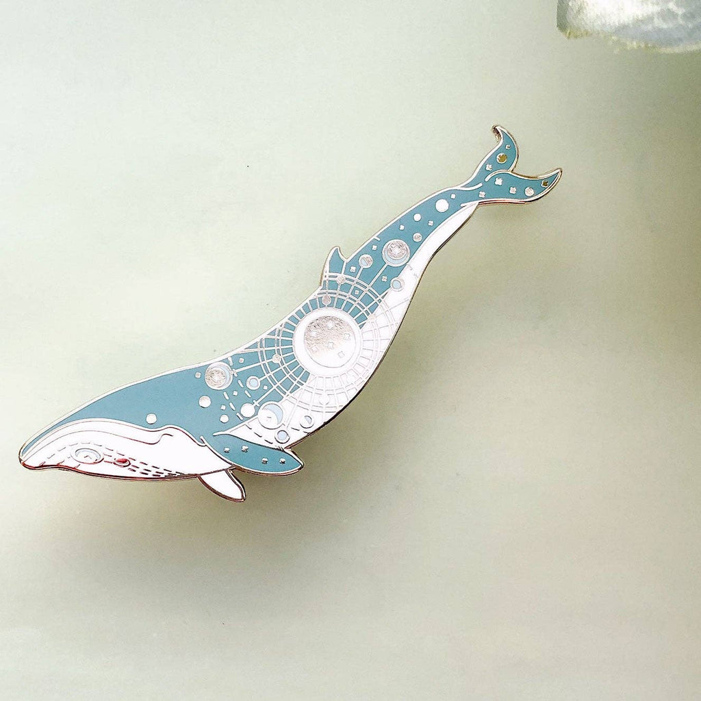 Decorative whale-shaped object on a light background