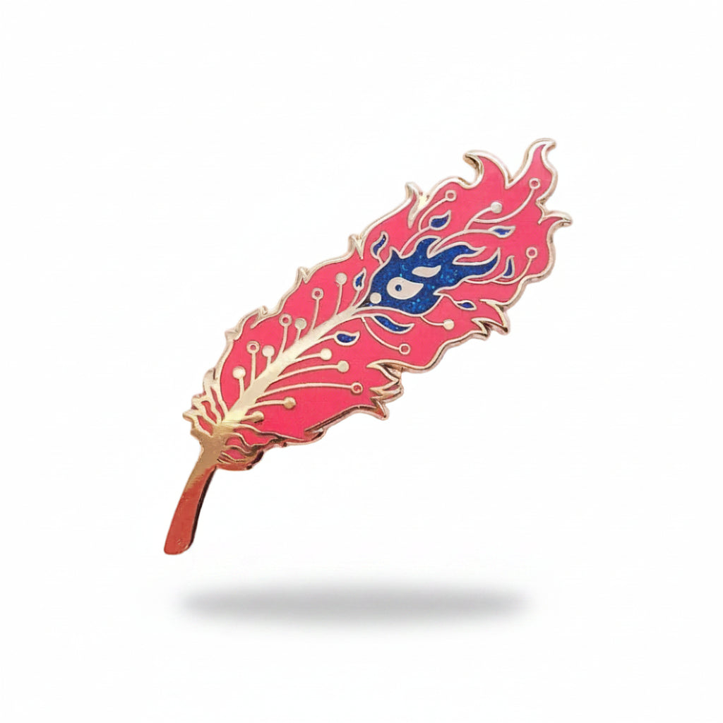 red feather-shaped phoenix pin with blue design on a light gray background