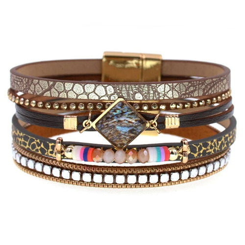 Boho layered, magnetic closure bracelet with faux leopard and brown faux leather, faceted beads,  silver and gold accents on a white background