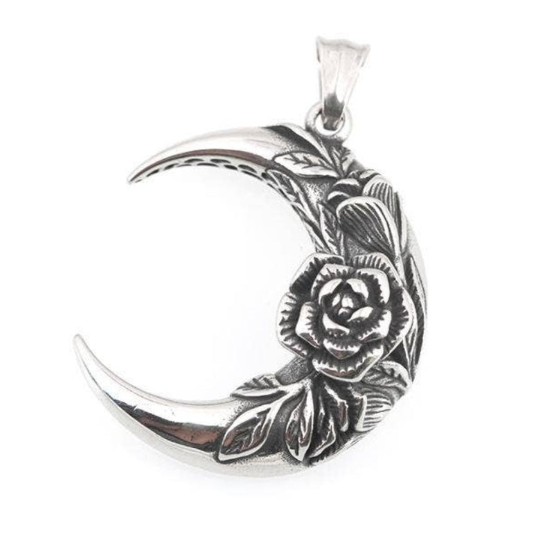 Silver crescent moon pendant with floral design on a white background