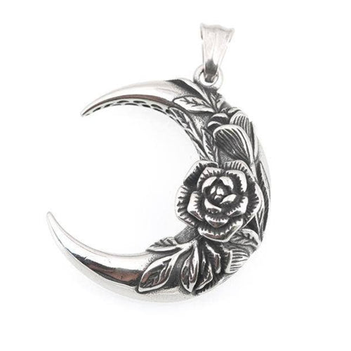 Silver crescent moon pendant with floral design on a white background