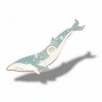 Decorative whale pin on a pink background with seashells